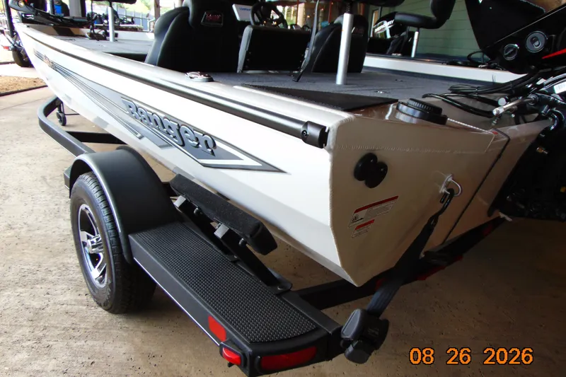 The Image of 2026 Ranger RT188 boat on trailer, side view, in a garage setting. - 0