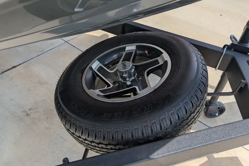 Slide: The Image of 2026 Ranger RT178 trailer tire and wheel on a concrete surface. - 12