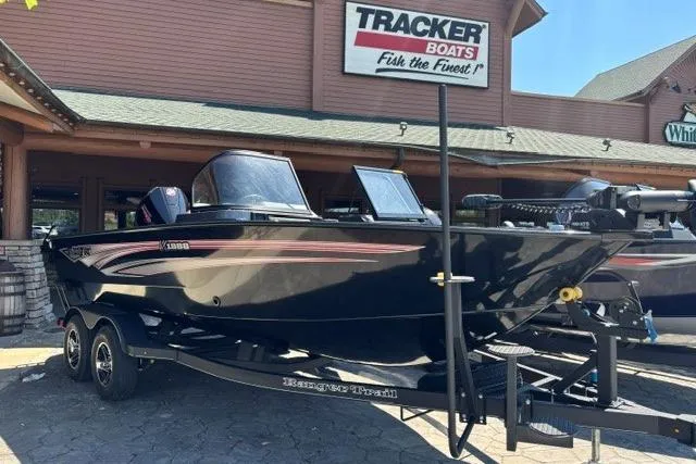Slide: The Image of 2026 Ranger VX1888 WT boat on trailer outside Tracker Boats dealership. - 6