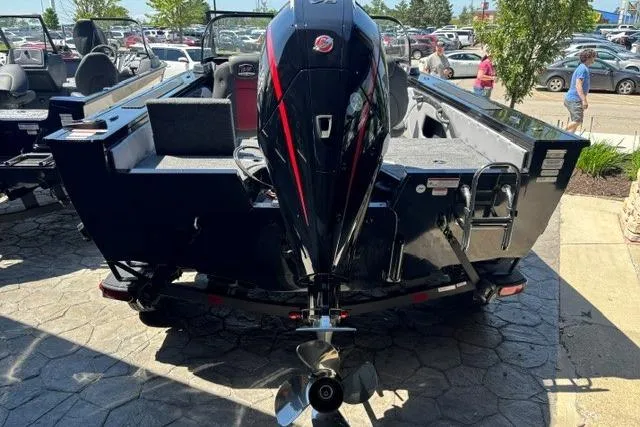 Slide: The Image of 2026 Ranger VX1888 WT boat with powerful outboard motor, parked outdoors. - 2