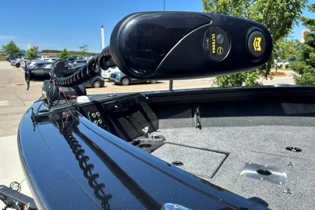 Slide: The Image of 2026 Ranger VX1888 WT boat with trolling motor, parked outdoors on a sunny day. - 5