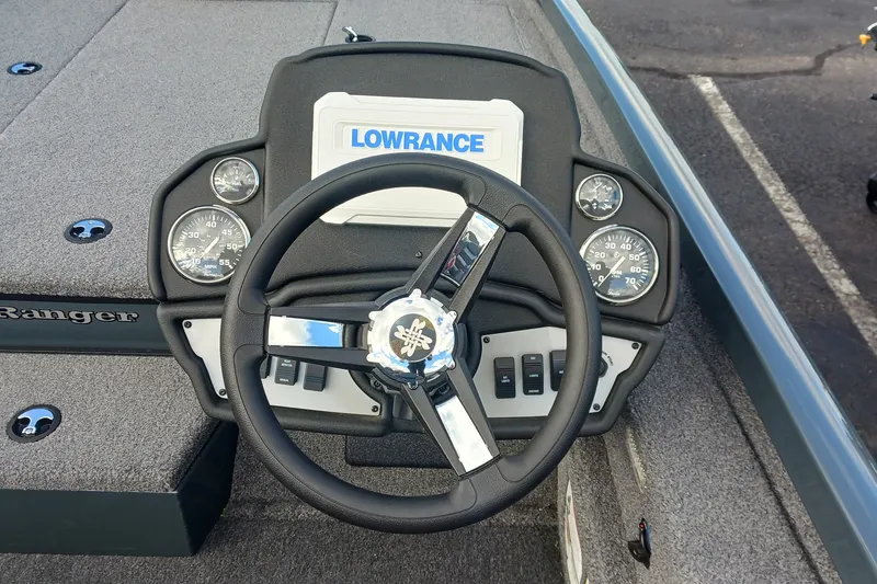 Slide: The Image of 2026 Ranger RT198P boat dashboard with steering wheel and Lowrance display. - 5