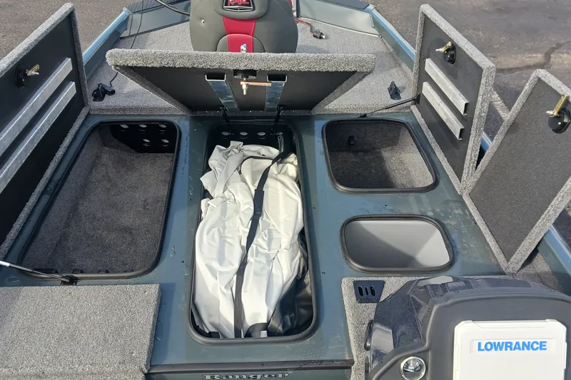 Slide: The Image of 2026 Ranger RT198P boat storage compartments with Lowrance electronics and seating. - 8