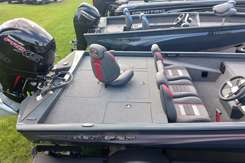 Slide: The Image of 2026 Ranger RT198P fishing boat with Mercury Pro XS engine, featuring spacious seating and deck. - 2