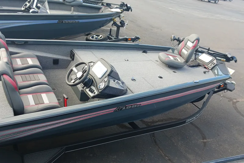 Slide: The Image of 2026 Ranger RT198P fishing boat with modern seating and steering console. - 3