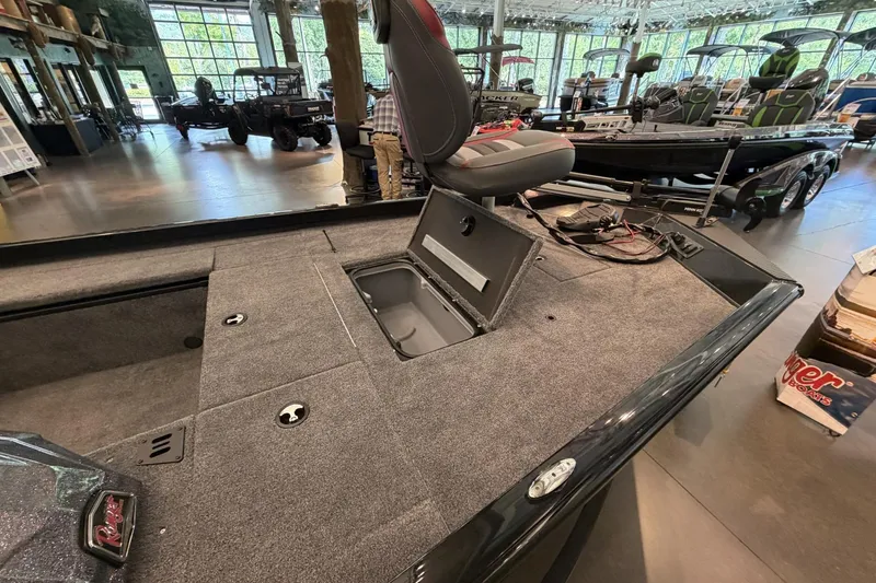 Slide: The Image of 2026 Ranger RT188C boat interior with open storage compartment in showroom. - 1