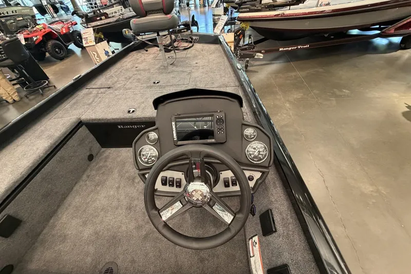Slide: The Image of 2026 Ranger RT188C boat interior with steering wheel and control panel. - 4