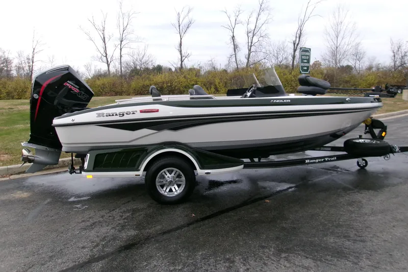 The Image of 2026 Ranger 1880MS boat on trailer, parked outdoors on a cloudy day. - 0