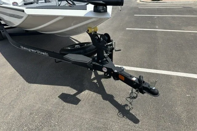 Slide: The Image of 2026 Ranger RT188 boat trailer hitch in a parking lot. - 8