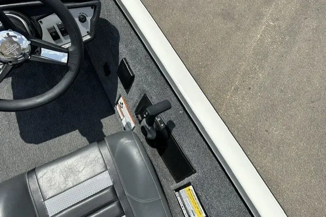 Slide: The Image of 2026 Ranger RT188 boat interior with steering wheel and seat detail. - 16