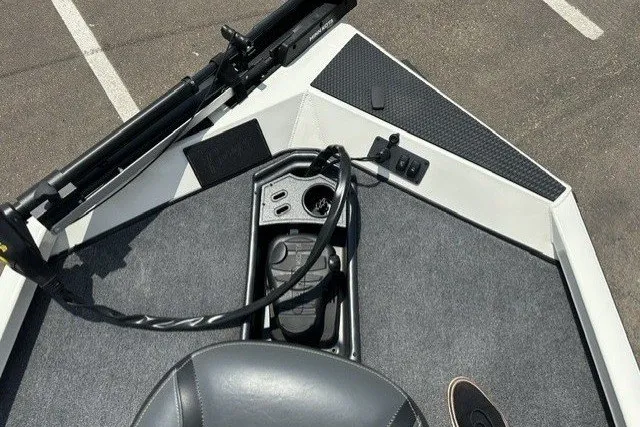Slide: The Image of The image shows the deck of a Ranger RT188 boat with gray carpeting and a seat. - 10