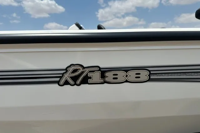 Slide: The Image of 2026 Ranger RT188 boat side view with logo under a cloudy sky. - 1