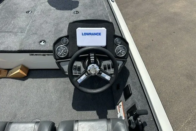 Slide: The Image of 2026 Ranger RT188 boat dashboard with Lowrance display and steering wheel. - 15