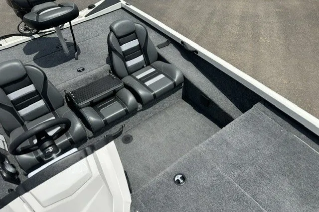 Slide: The Image of 2026 Ranger RT188 boat interior with gray seating and carpeted flooring. - 17