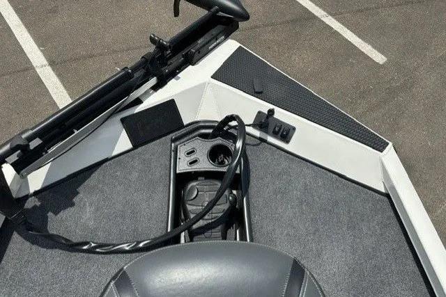 Slide: The Image of The image shows the deck of a Ranger RT188 boat with gray carpeting and control elements. - 11