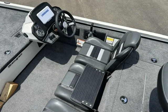 Slide: The Image of 2026 Ranger RT188 boat interior with steering console and seating, featuring Lowrance electronics. - 14