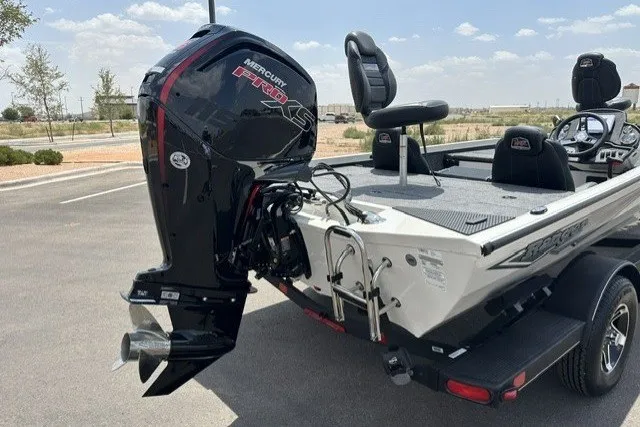 Slide: The Image of 2026 Ranger RT188 boat with Mercury Pro XS engine, parked outdoors. - 3