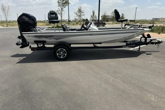 Slide: The Image of 2026 Ranger RT188 boat on trailer, parked outdoors on a sunny day. - 7