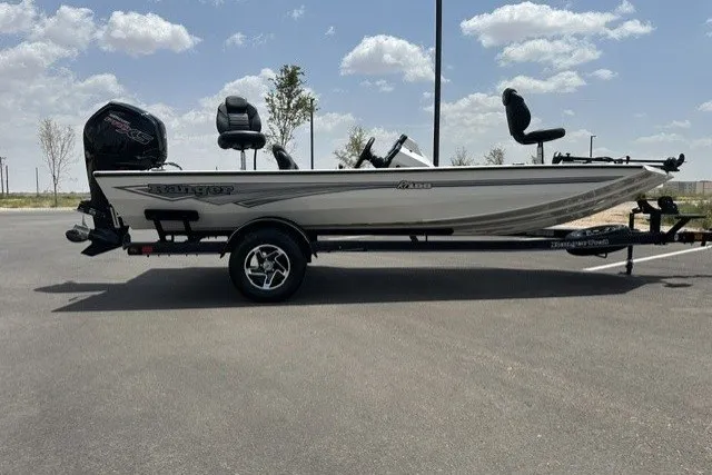 Slide: The Image of 2026 Ranger RT188 boat on trailer under clear sky. - 6