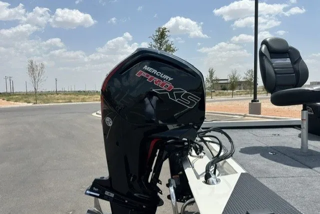 Slide: The Image of 2026 Ranger RT188 boat with Mercury Pro XS outboard motor in a sunny outdoor setting. - 4