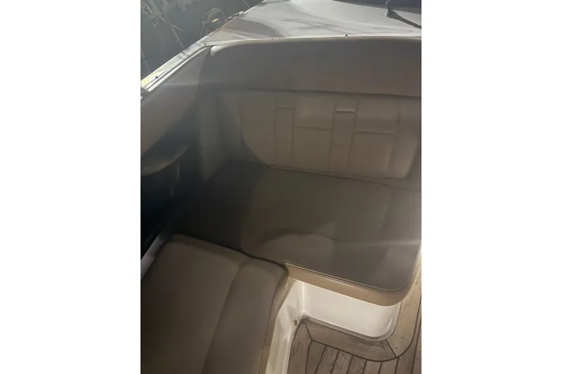 Slide: The Image of Interior seating of 2015 Sea Ray 350 SLX boat, featuring cushioned upholstery. - 16