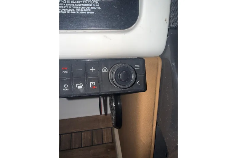 Slide: The Image of Control panel of a 2015 Sea Ray 350 SLX boat with various buttons and dials. - 21