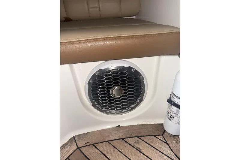 Slide: The Image of 2015 Sea Ray 350 SLX boat interior with speaker and fire extinguisher. - 24