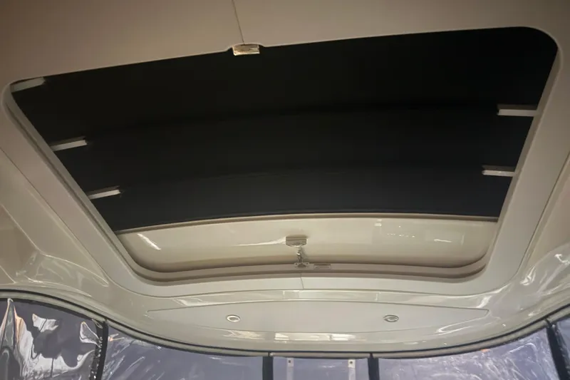 Slide: The Image of Interior view of 2015 Sea Ray 350 SLX boat's retractable sunroof. - 25