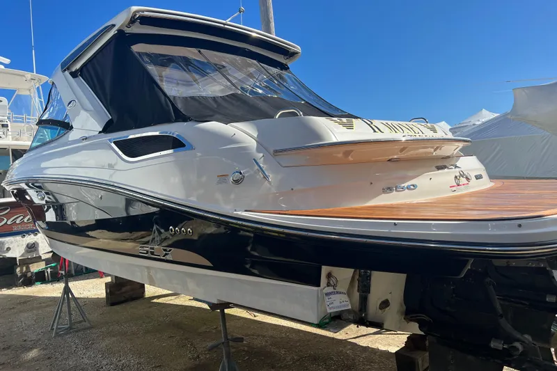 Slide: The Image of 2015 Sea Ray 350 SLX boat on display, featuring sleek design and modern amenities. - 4