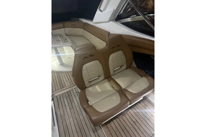 Slide: The Image of 2015 Sea Ray 350 SLX interior with tan leather seating and wooden flooring. - 7