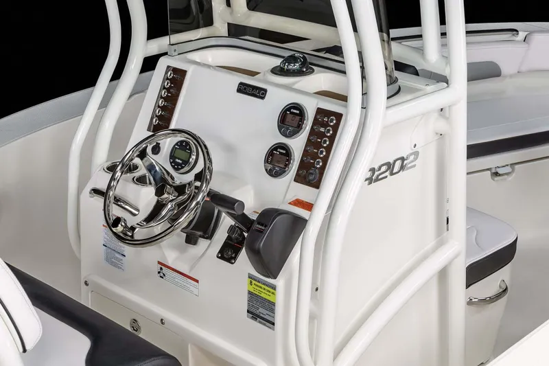 Slide: The Image of Manufacturer Provided Image: 2025 Robalo R202 Explorer boat dashboard with steering wheel and control panel. - 12