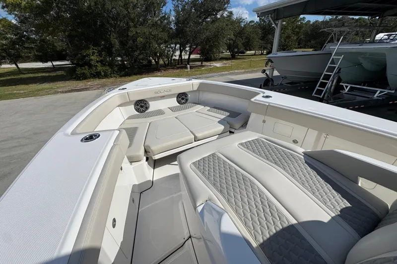Slide: The Image of 2026 Solace 32 CS boat interior with cushioned seating and modern design. - 19