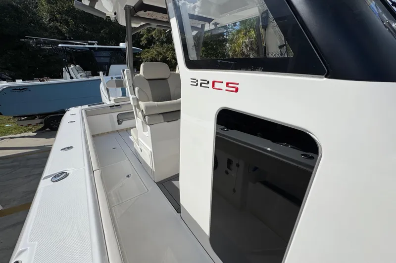 Slide: The Image of 2026 Solace 32 CS boat, sleek design with comfortable seating and modern features. - 24