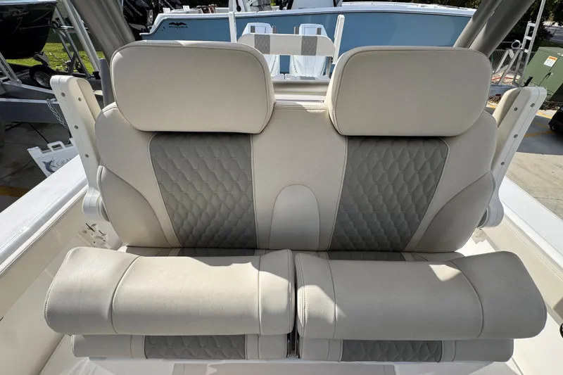 Slide: The Image of Luxurious seating on 2026 Solace 32 CS boat, featuring elegant gray and white upholstery. - 35