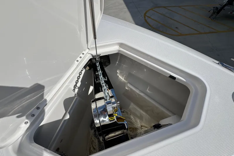 Slide: The Image of Anchor compartment of 2026 Solace 32 CS boat, featuring a polished anchor chain. - 37