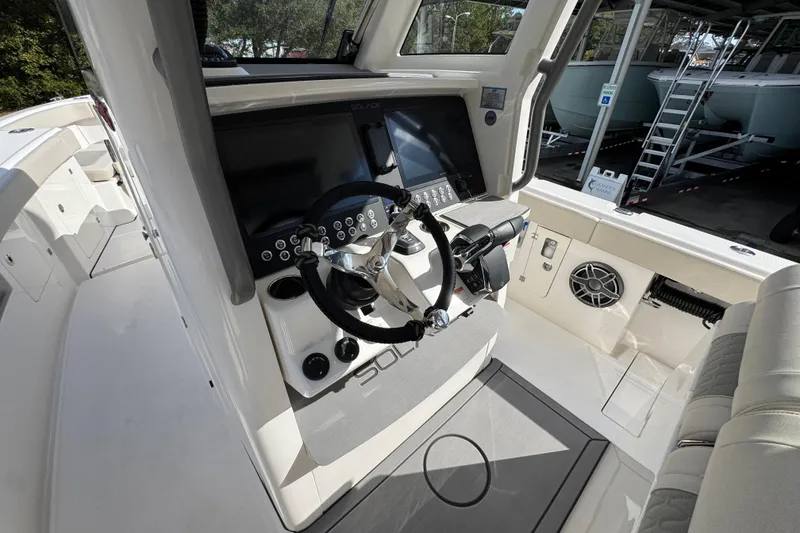 Slide: The Image of 2026 Solace 32 CS boat cockpit with modern steering and control panel. - 38