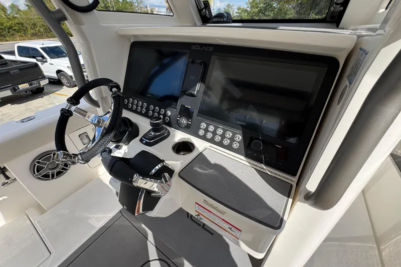 Slide: The Image of 2026 Solace 32 CS boat dashboard with advanced navigation and control systems. - 41