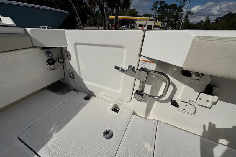 Slide: The Image of 2026 Solace 32 CS boat interior with safety gate and control panel. - 46