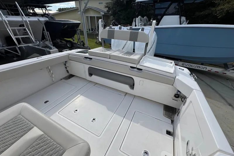 Slide: The Image of 2026 Solace 32 CS boat interior with seating and storage compartments. - 48