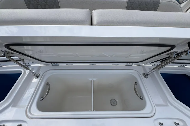 Slide: The Image of Open storage compartment on 2026 Solace 32 CS boat, showcasing sleek design and functionality. - 51