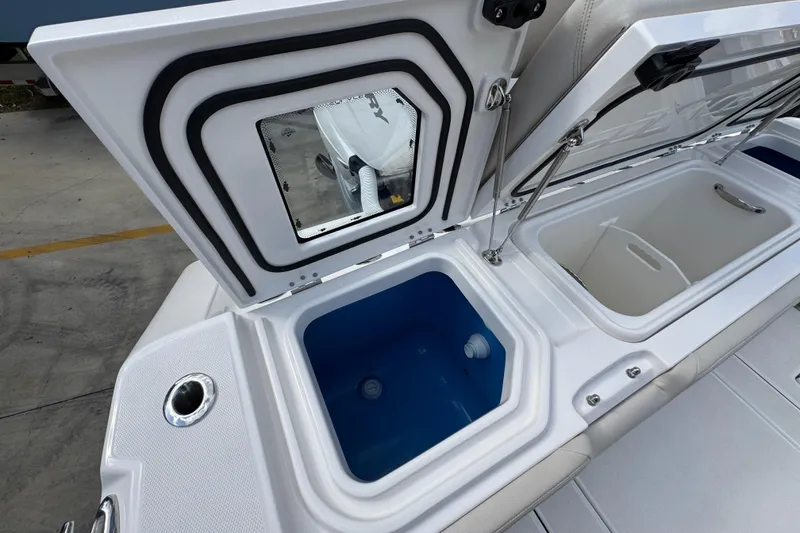 Slide: The Image of Open storage compartments on 2026 Solace 32 CS boat, featuring sleek design and functionality. - 53