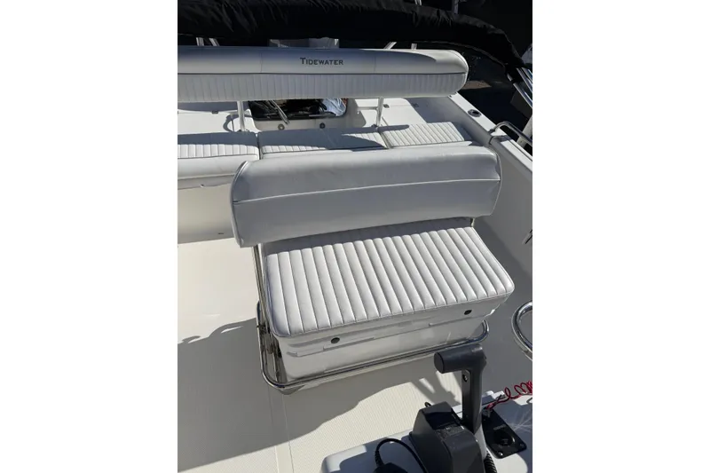 Slide: The Image of 2008 Tidewater 2100 Bay Max boat interior with white cushioned seating. - 11