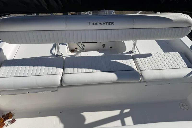Slide: The Image of 2008 Tidewater 2100 Bay Max boat with white cushioned seating. - 12