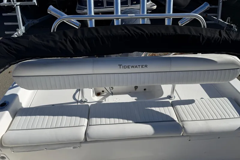 Slide: The Image of 2008 Tidewater 2100 Bay Max boat interior with white seating and stainless steel details. - 13