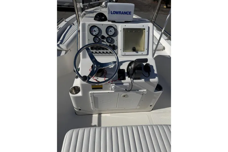 Slide: The Image of 2008 Tidewater 2100 Bay Max boat console with steering wheel and navigation equipment. - 7