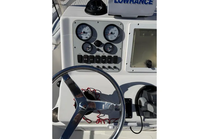 Slide: The Image of 2008 Tidewater 2100 Bay Max boat dashboard with steering wheel and gauges. - 8