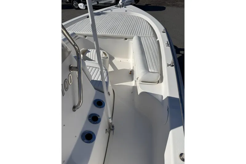 Slide: The Image of 2008 Tidewater 2100 Bay Max boat interior with white seating and deck. - 9