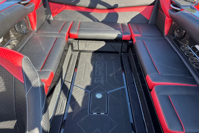 Slide: The Image of Luxurious interior of 2026 Supreme S240 boat with black and red seating. - 12