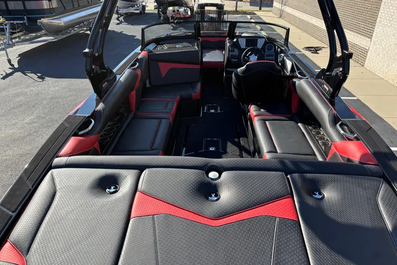 Slide: The Image of 2026 Supreme S240 boat interior with black and red seating, showcasing modern design. - 5