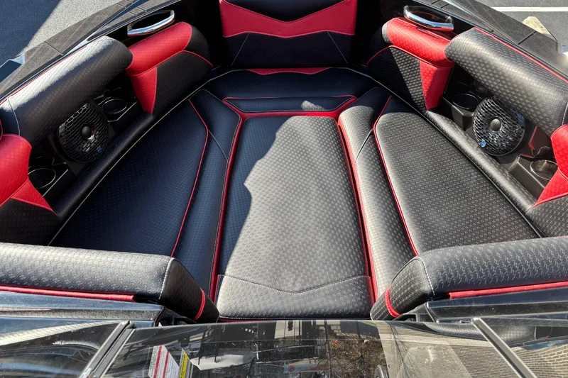 Slide: The Image of Luxurious interior of 2026 Supreme S240 boat with black and red seating. - 6